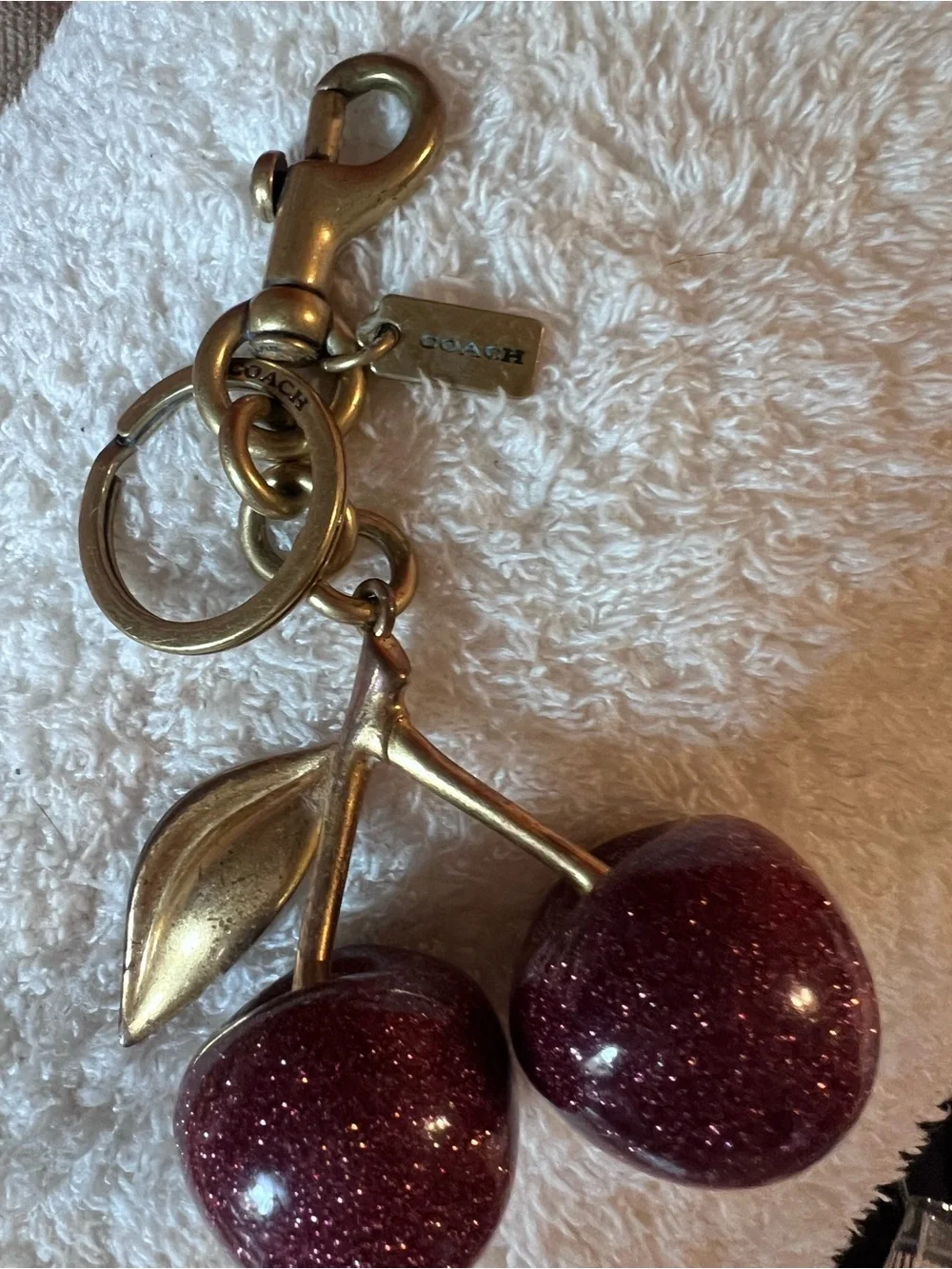 Coach Glitter Cherry Keyring in Burgundy with Gold Hardware